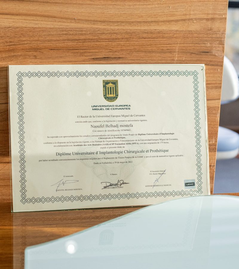 Diploma of Dr. Naoufel, a dentist and dental surgeon in Algeria, in Constantine specialized in dental implants and a graduate of the University of Miguel Cervantes in Spain
