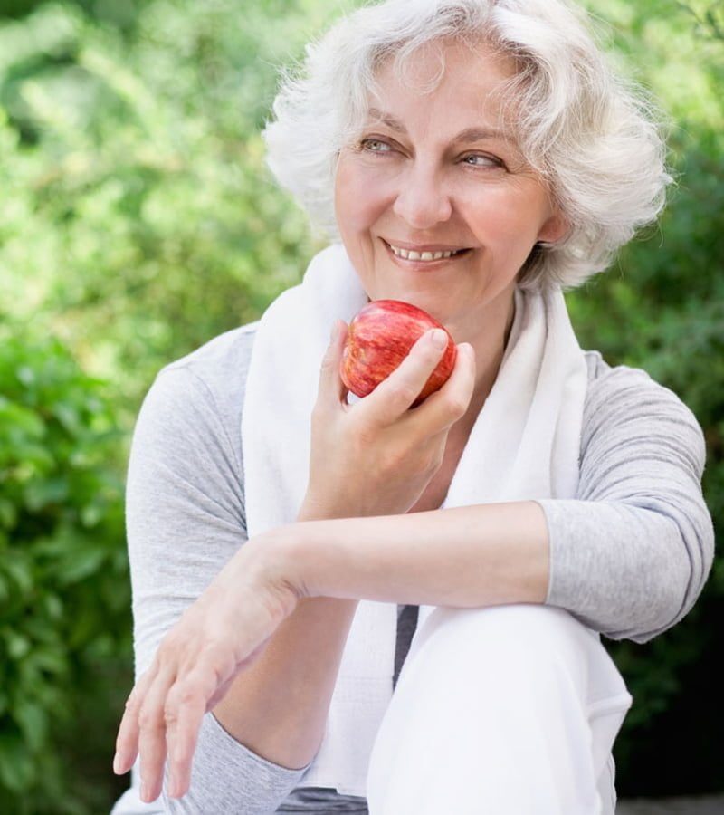elderly woman wearing a removable denture